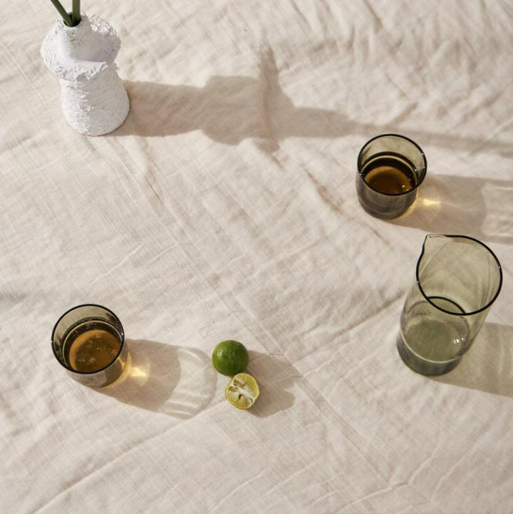 Olive green drinking glasses and carafe from above
