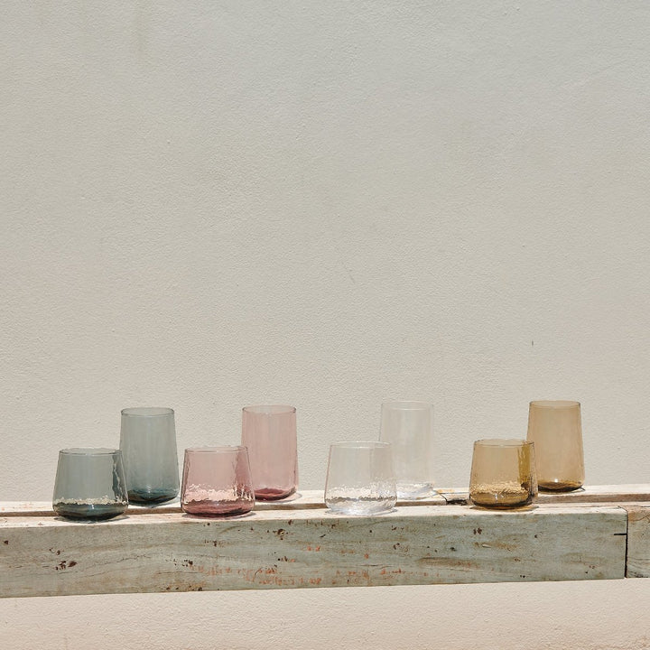 Handmade coloured drinking glasses in smoke grey pink clear brown