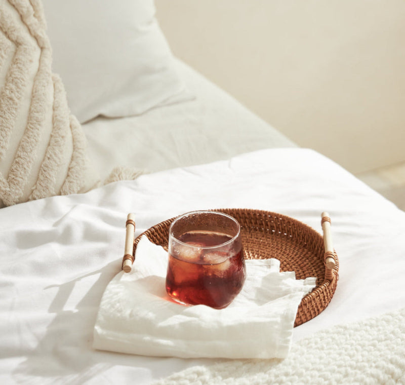 Uniquely shaped drinking glass in clear
