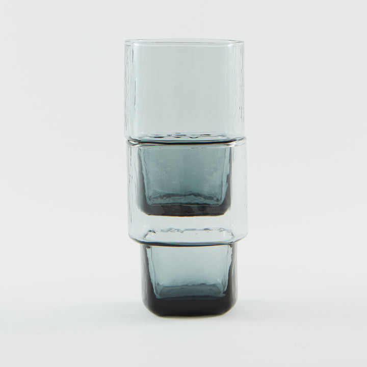 Unique, stackable handmade drinking glasses with an unusual shape and hammered texture in smoke grey