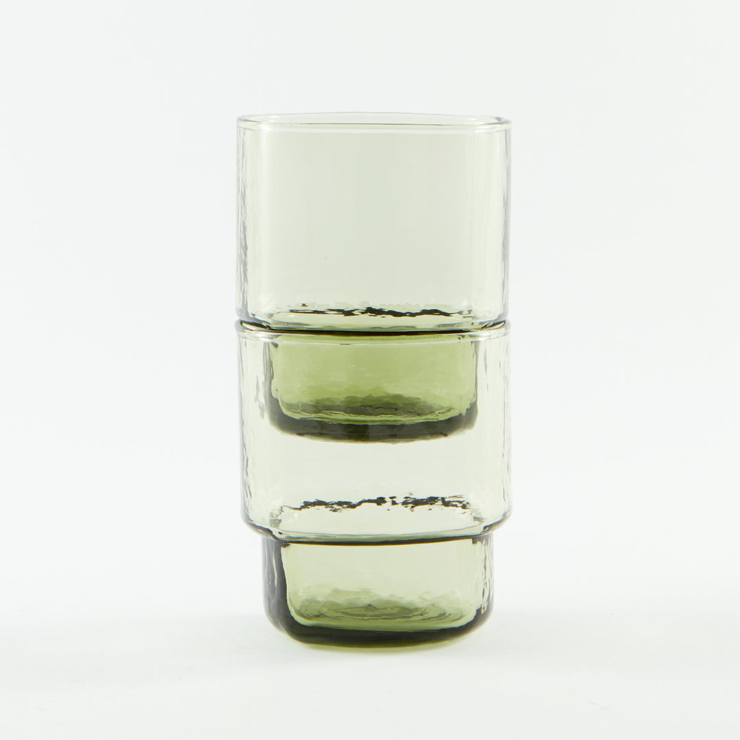 Modern, big, stackable coloured handmade drinking glasses in olive green