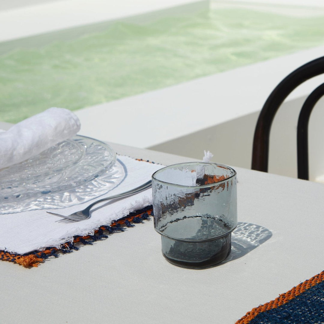 Modern, big, stackable coloured drinking glasses in blue grey 