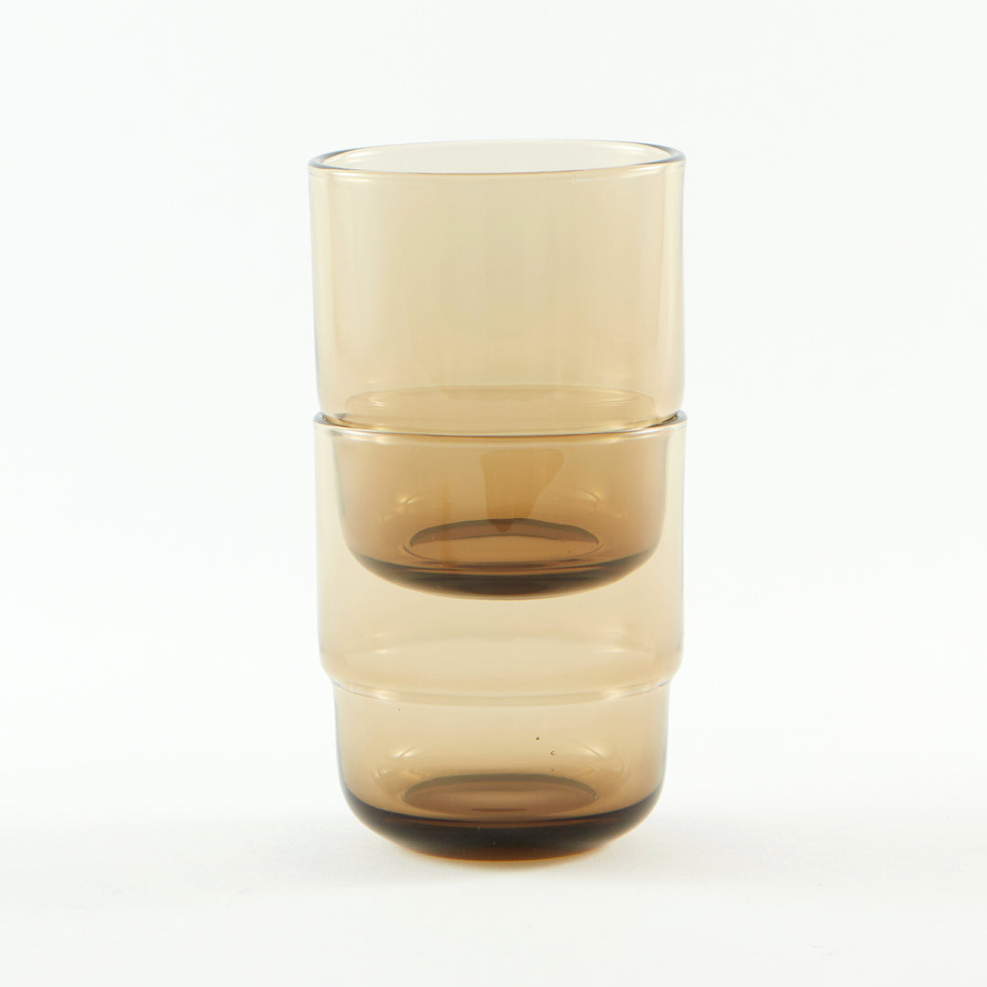 Sturdy, stackable, minimalistic small coloured drinking glasses in brown 