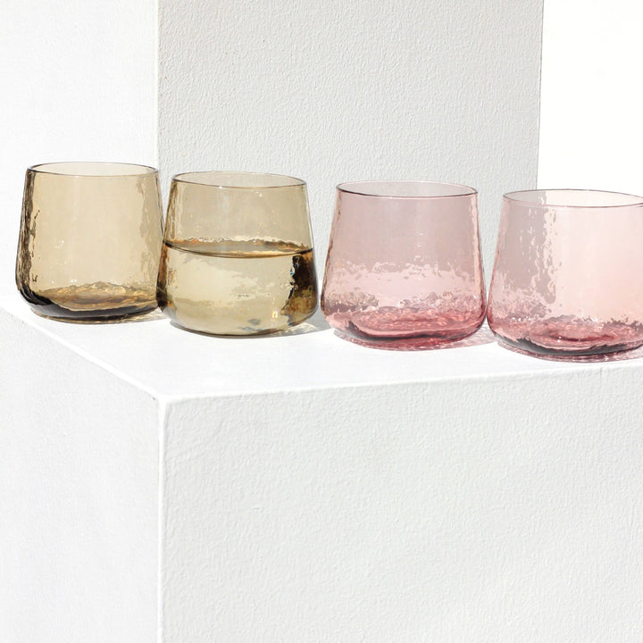 Pink and brown minimalistic drinking glass with a unique shape